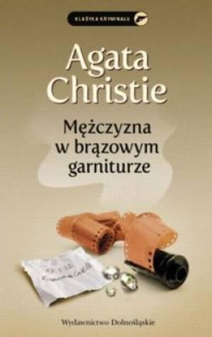 MĘŻCZYZNA W BRĄZOWYM GARNITURZE